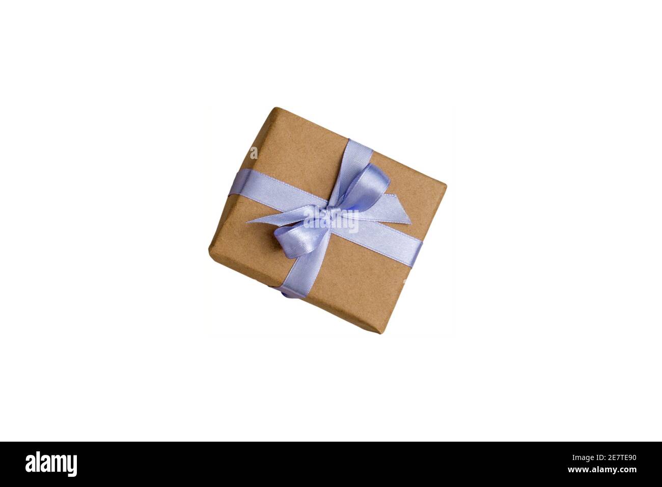 Gift box wrapped with kraft brown paper and tied with satin light purple ribbon isolated on white Stock Photo
