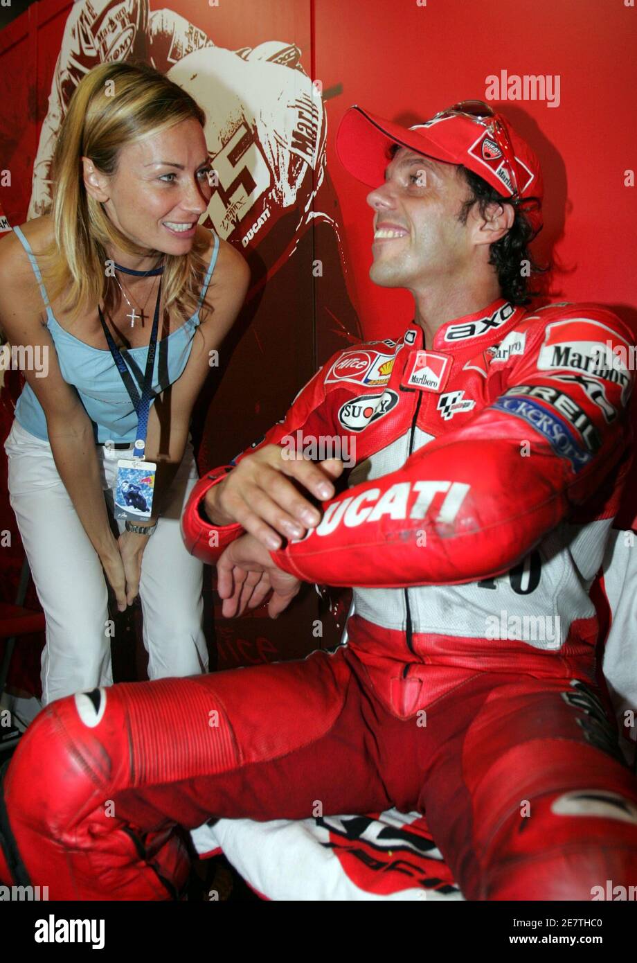 Motogp Rider Capirossi Of Italy Celebrates With Wife After Capturing Pole Position At Twin Ring Motegi Circuit In Japan Motogp Rider Loris Capirossi R Of Italy Smiles With His Wife Ingrid Tence