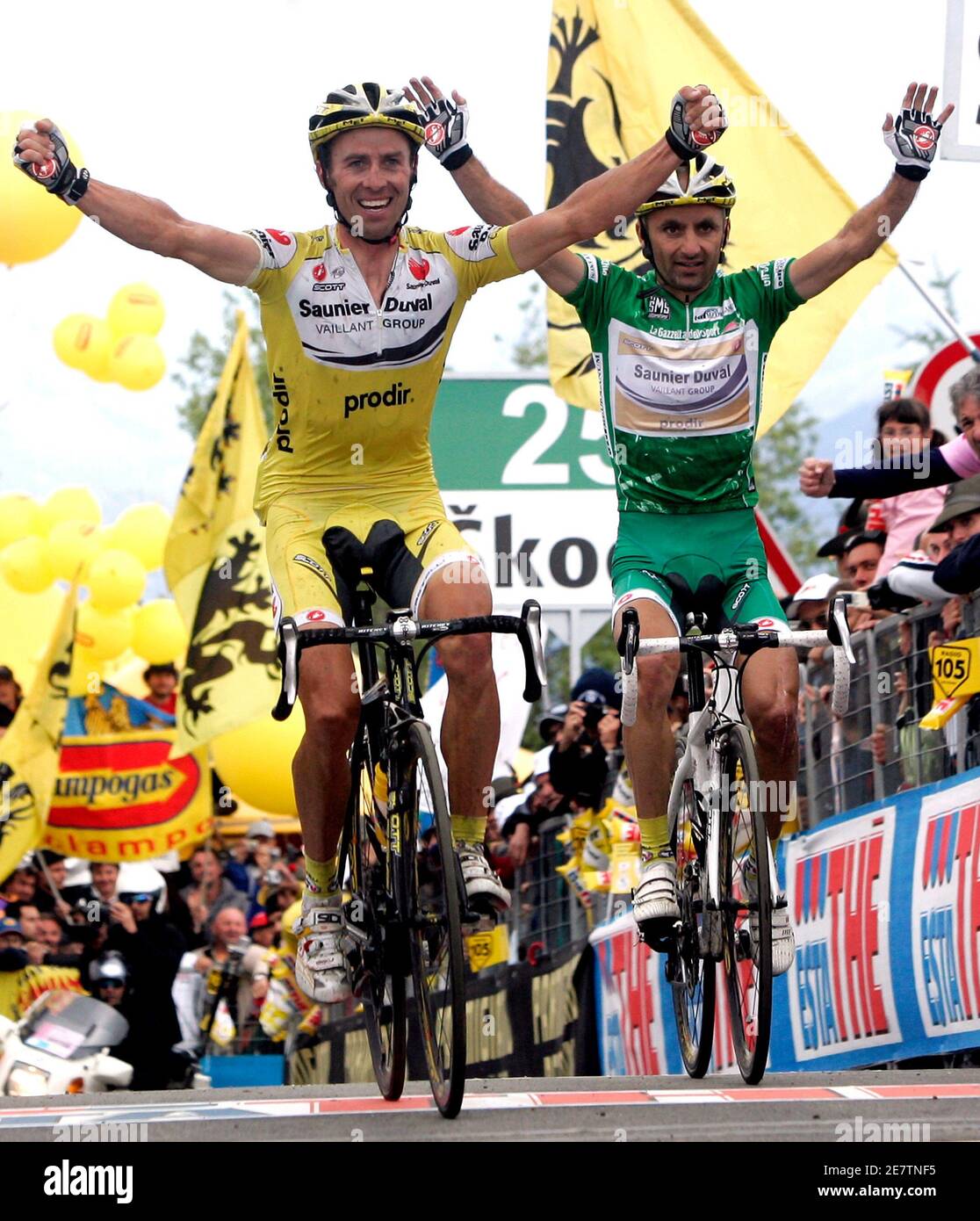 italian-rider-gilberto-simoni-l-celebrates-as-he-crosses-the-finish-line-followed-by-his-team-mate-leonardo-piepoli-after-the-17th-stage-of-the-giro-ditalia-cycling-race-from-lienz-to-monte-zoncolan-may-30-2007-simoni-won-the-stage-while-italian-rider-danilo-di-luca-took-the-leaders-pink-jersey-reutersalessandro-bianchi-italy-2E7TNF5.jpg