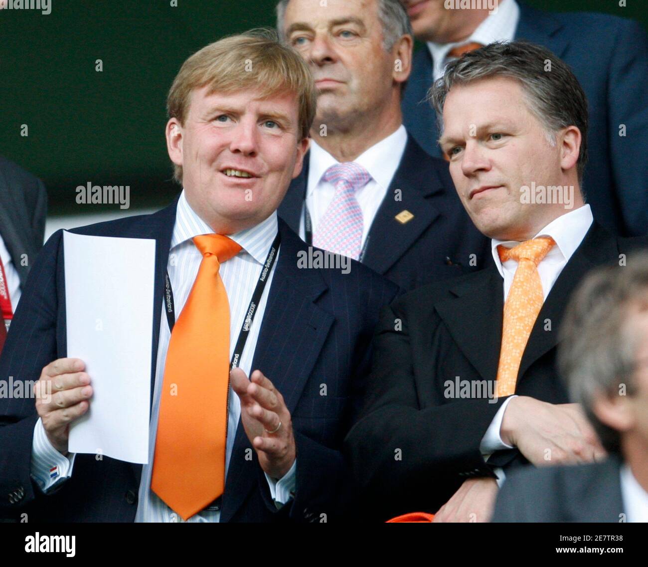 Crown Prince Willem Alexander of the Netherlands sits with Dutch Finance  Minister Wouter Bos (R) before their Group C Euro 2008 soccer match against  Italy at the Stade de Suisse stadium in