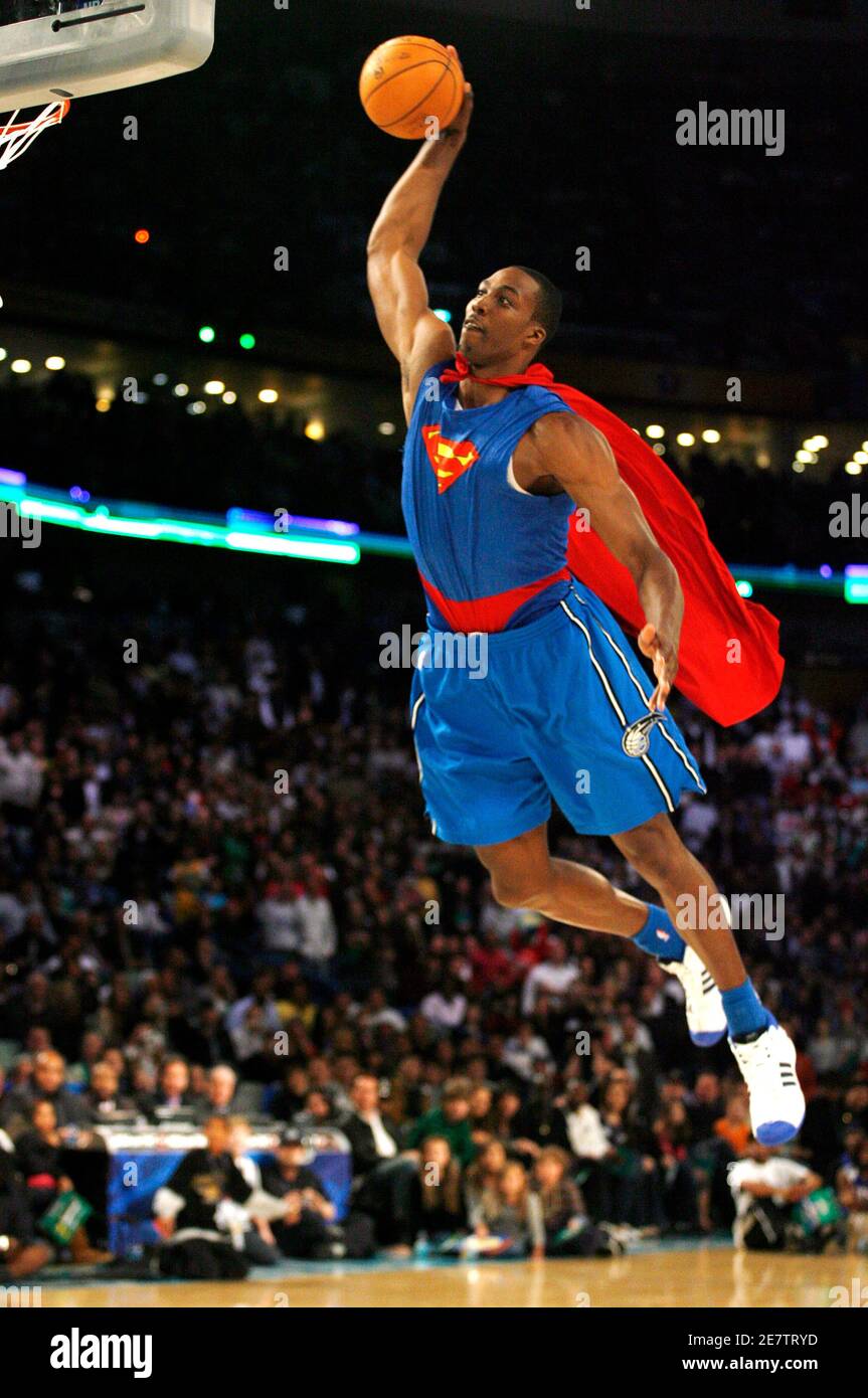 Orlando Magic Dwight Howard makes a dunk wearing a superman costume during  the NBA All-Star basketball Slam Dunk competition in New Orleans, Louisiana  February 16, 2008. REUTERS/Jeff Haynes (UNITED STATES Stock Photo -