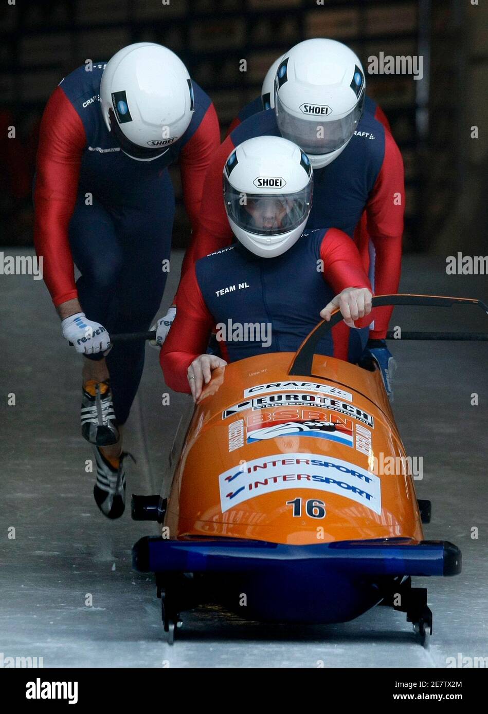 Team Netherland 1 with Edwin van Calker (front), Arnold van Calker, Sybren Jansma and Arno Klaasen push the bob during the start at the first run of the men's Bobsleigh World Cup race in the southern Bavarian resort of Koenigssee January 11, 2009. Team Germany 2 with Karl Angerer, Andreas Udvari, Alex Mann and Gregor Bermbach won the race ahead of Team Netherland 1 and two third places with Germany 1 with Andre Lange, Rene Hoppe, Alexander Roediger and Martin Putze and Team Latvia 1 with Janis Minins, Daumants Dreiskens, Oskars Melbardis and Intars Dambis.    REUTERS/Michaela Rehle (GERMANY) Stock Photo