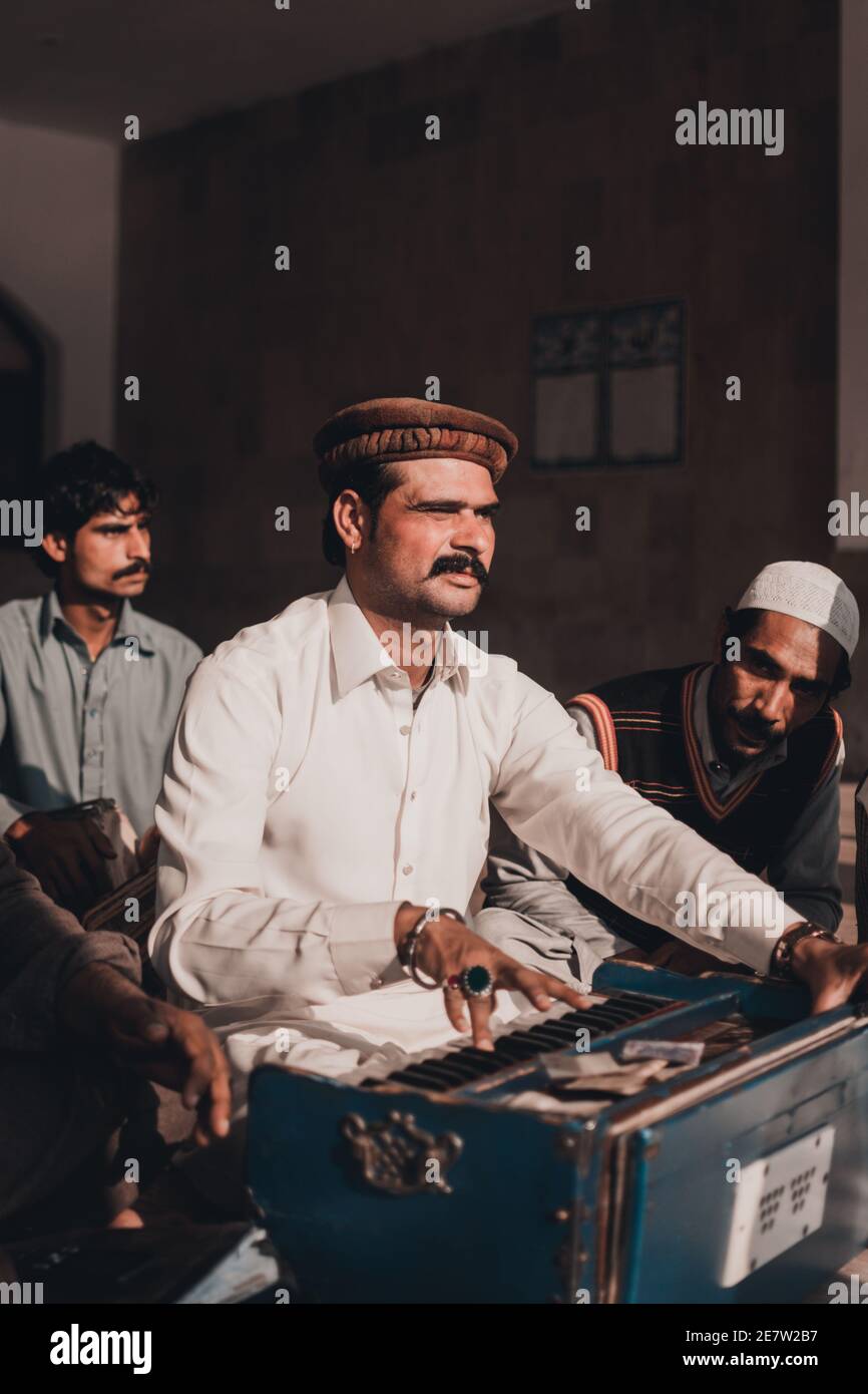 Pakistani folk musicians performing live qawali at Baba Bulleh Shah shrine Kasur, Punjab Stock Photo