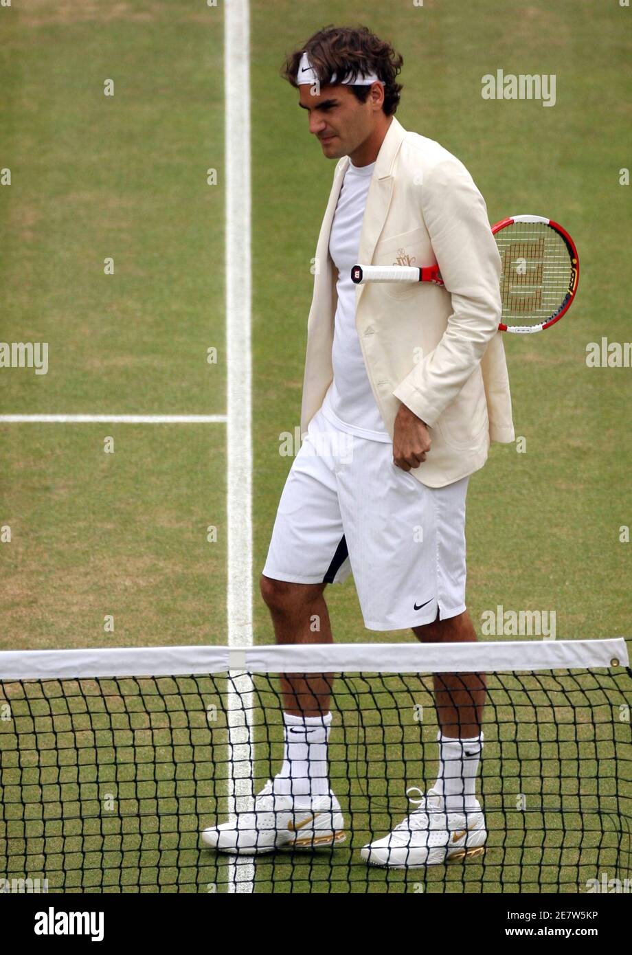 Switzerland's Roger Federer arrives on court wearing a blazer before his  men's final match against Spain's Rafael Nadal at the Wimbledon tennis  championships in London July 9, 2006. REUTERS/Alessia Pierdomenico (BRITAIN  Stock