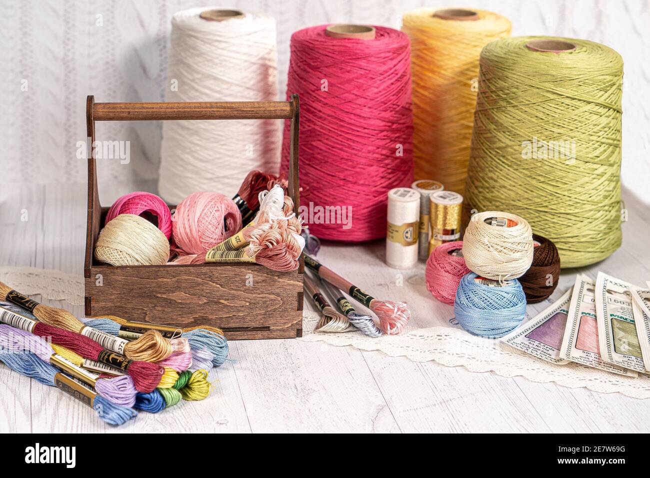 Threads in reels. Colored bobbins for embroidery knitting hobby accessories creativity. Background for site Stock Photo