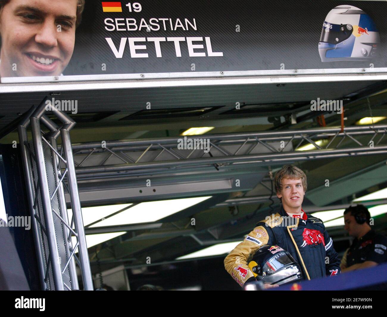 Toro Rosso Formula One driver Sebastian Vettel of Germany poses for photographers in the pit during the first free practice for the Hungarian F1 Grand Prix at the Hungaroring near Budapest August 3, 2007. The Hungarian F1 Grand Prix will take place on Sunday, August 5.  REUTERS/Ivan Milutinovic (HUNGARY) Stock Photo