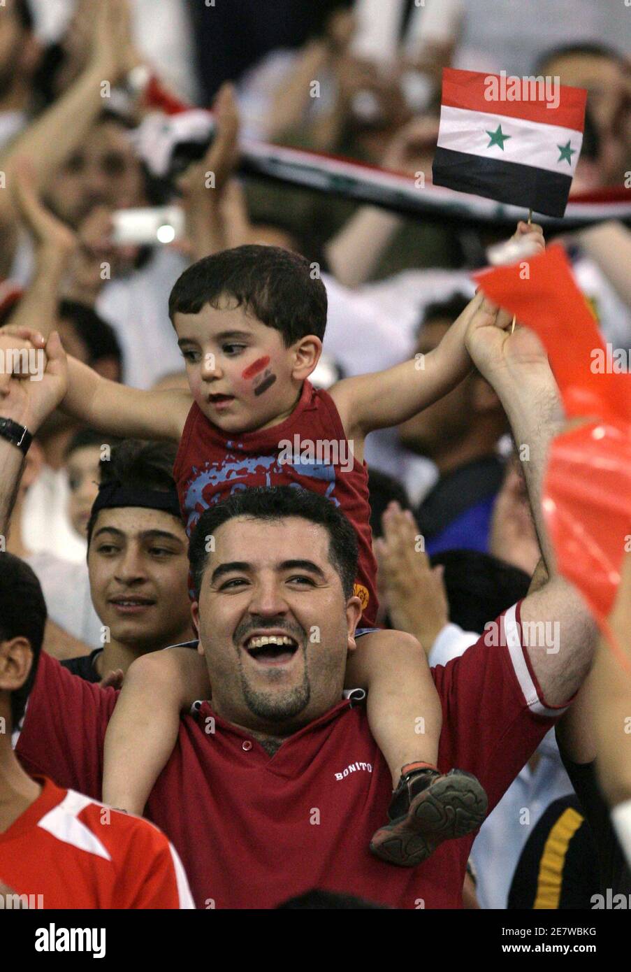 Syrian fans cheer for their team during a friendly soccer match with Saudi Arabia in Riyadh May 24, 2008.      REUTERS/Fahad Shadeed   (SAUDI ARABIA) Stock Photo