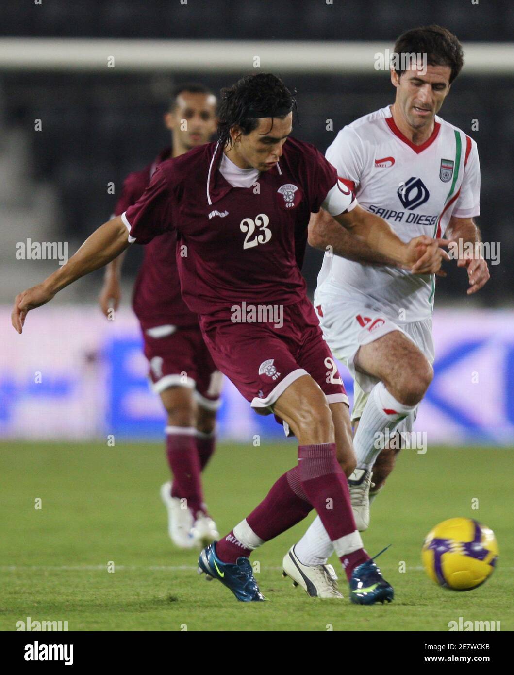 Qatar S Sebastian Soria Fights For The Ball With Iran S Karim Bagheri R During A Friendly Soccer Match In Doha November 9 08 Reuters Fadi Al Assaad Qatar Stock Photo Alamy