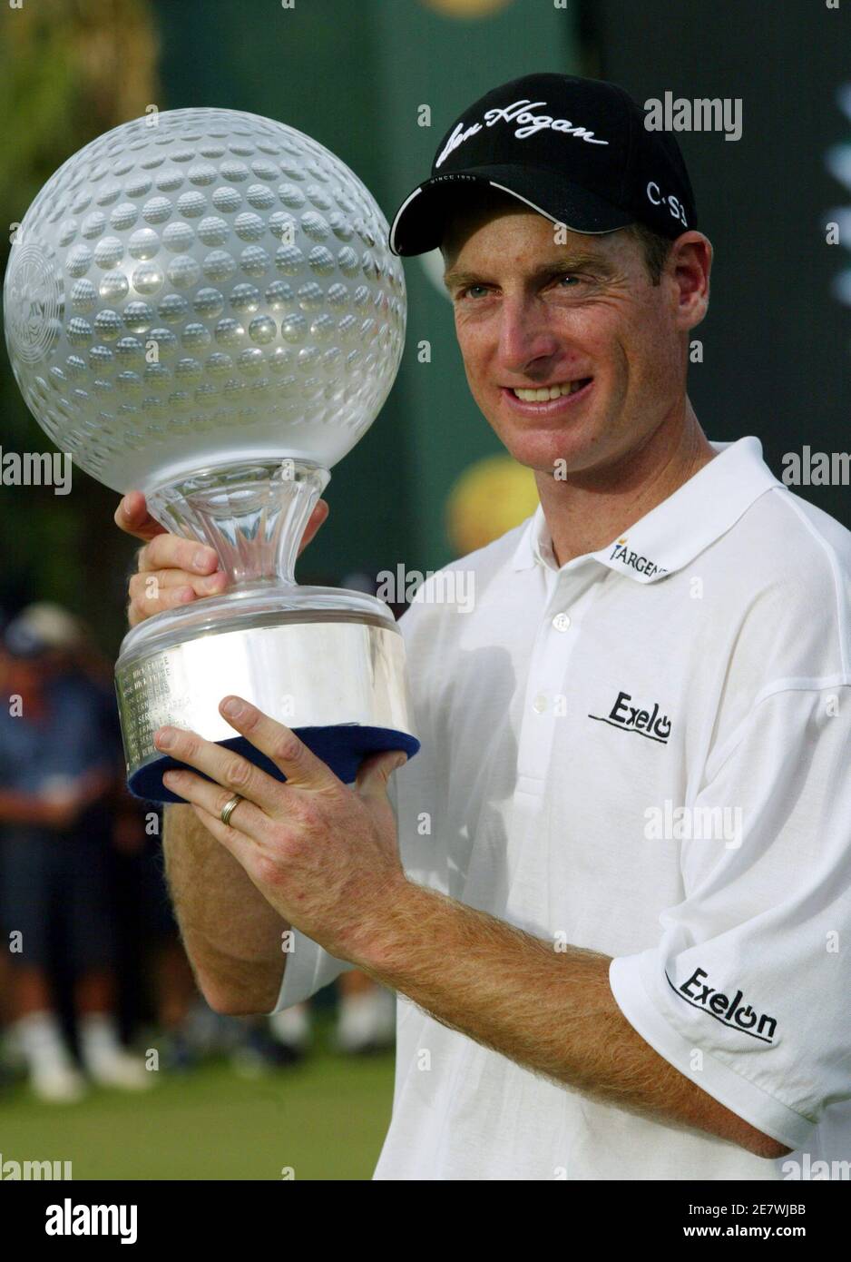 Jim Furyk of the U.S. holds the champions trophy after winning the Sun City Golf Challenge in Sun City, South Africa December 4, 2005. Furyk chipped in on the second extra hole of a sudden-death playoff to win the 25th Sun City Golf Challenge on Sunday. Furyk's birdie from 15-feet from the back of the par-four 18th green beat off Briton Darren Clarke and Australia's Adam Scott for the $1.2 million first prize. REUTERS/Juda Ngwenya Stock Photo