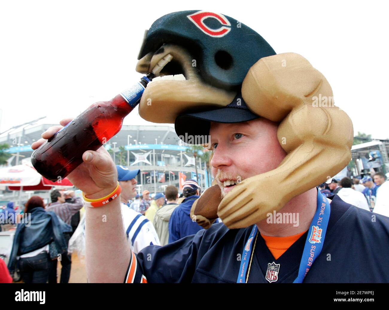 A Chicago Bears fan jokingly holds a 