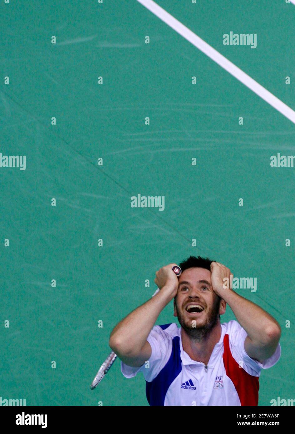 Erwin Kehlhoffner of France reacts after defeating Eli Mambwe of Zambia in their men's singles round of 32 badminton match at the Beijing 2008 Olympic Games, August 11, 2008.     REUTERS/Beawiharta (CHINA) Stock Photo
