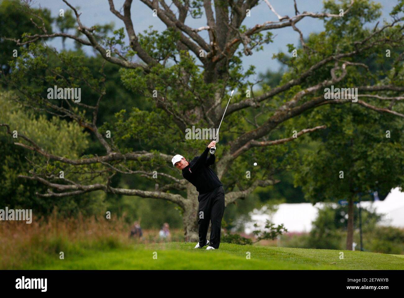 Scotland's Paul Lawrie plays his second shot at the second hole during his second round of the Scottish Open golf tournament at Loch Lommond near Glasgow, Scotland, July 11, 2008. REUTERS/David Moir (BRITAIN) Stock Photo