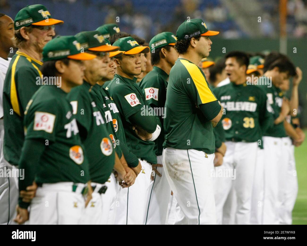 Taiwan's Uni-President 7-Eleven Lions team members attend an awards  ceremony after losing against Japan's Seibu Lions at the Asia Series 2008  baseball final game at the Tokyo dome in Tokyo November 16,
