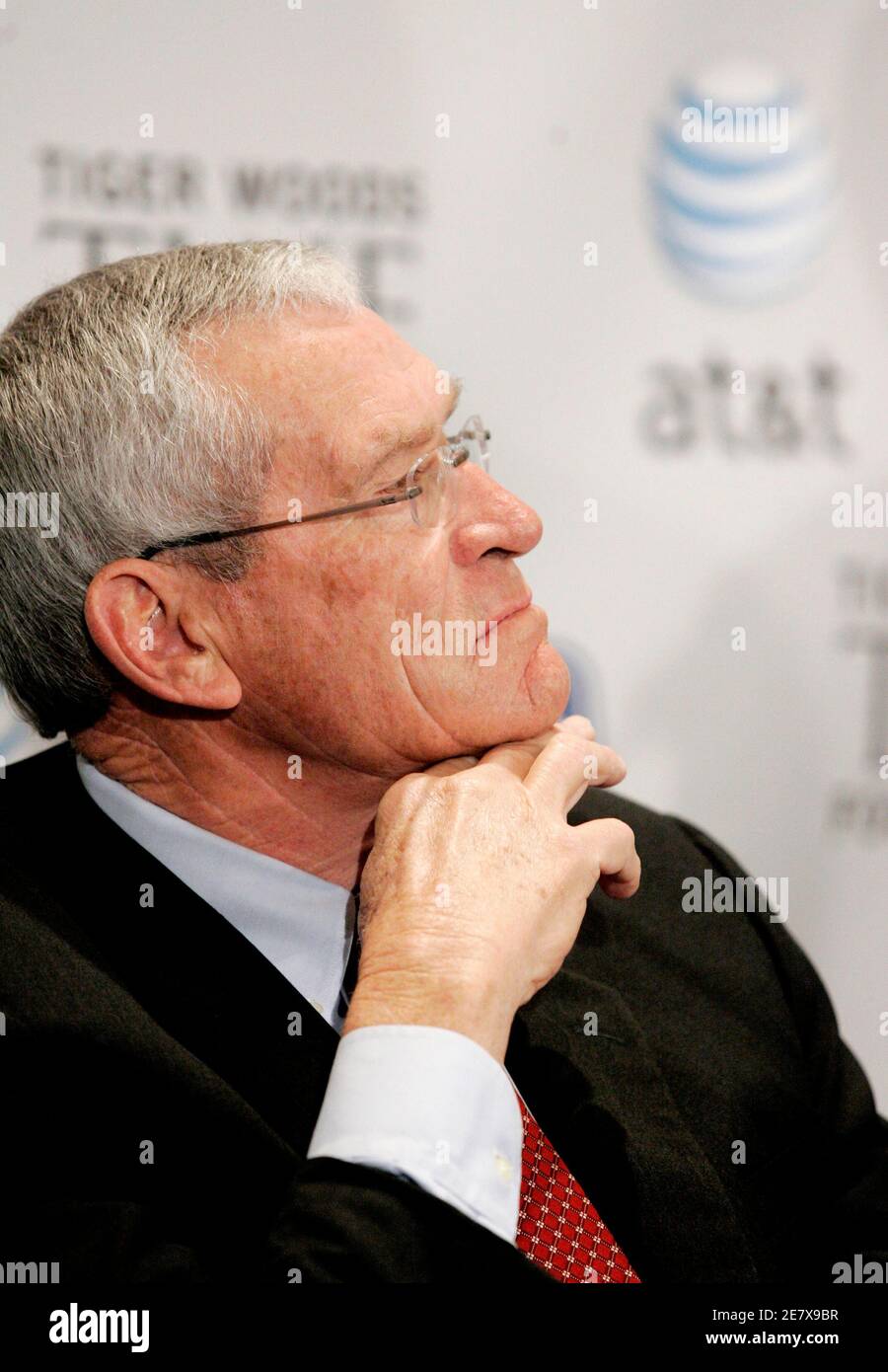 AT&T Chairman and CEO Edward Whitacre, Jr. listens during a news conference in Washington March 7, 2007. Whitacre was on hand for the announcement of the new AT&T National golf tournament that Tiger Woods will host and play in. The new event will have a six million dollar purse that will benefit the Tiger Woods Foundation and is scheduled to be played July 2-8 at the Congressional Country Club in suburban Maryland.        REUTERS/Gary Cameron  (UNITED STATES) Stock Photo