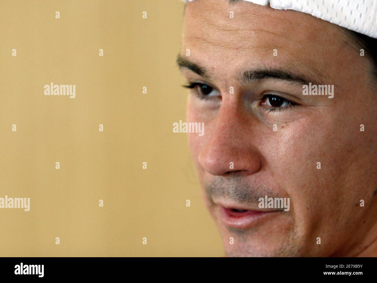 Guillermo Coria of Argentina speaks at a news conference after he retired early from a match against his compatriot Juan Pablo Brzezicki during the Copa Petrobras tennis tournament at the Pampulha Yacht Club in Belo Horizonte, central Brazil, October 23, 2007. Coria, former world number three, returned to competition after 13 months of inactivity due to shoulder problems, but retired from the match after losing the first set 3-6 and complaining of pain. REUTERS/Washington Alves (BRAZIL) Stock Photo