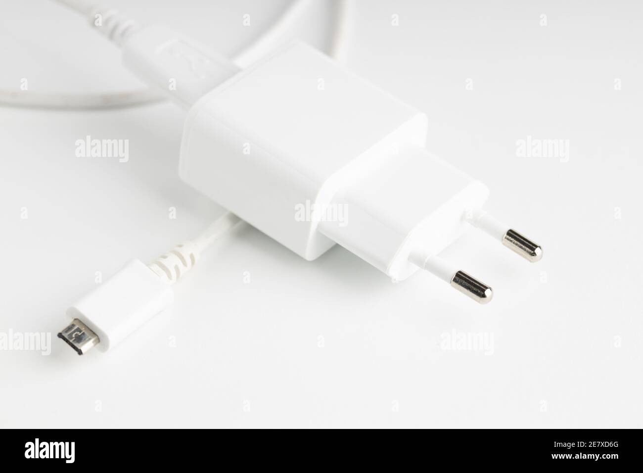 white usb charger for mobile devices on light background Stock Photo