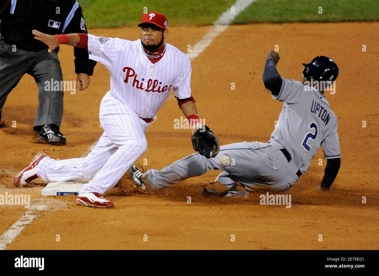 Tampa Bay Rays B J Upton Steals Third Base As Philadelphia Phillies Third Baseman Pedro Feliz Is Unable To Handle The Throw In The Eighth Inning In Game 3 Of Major League Baseball S