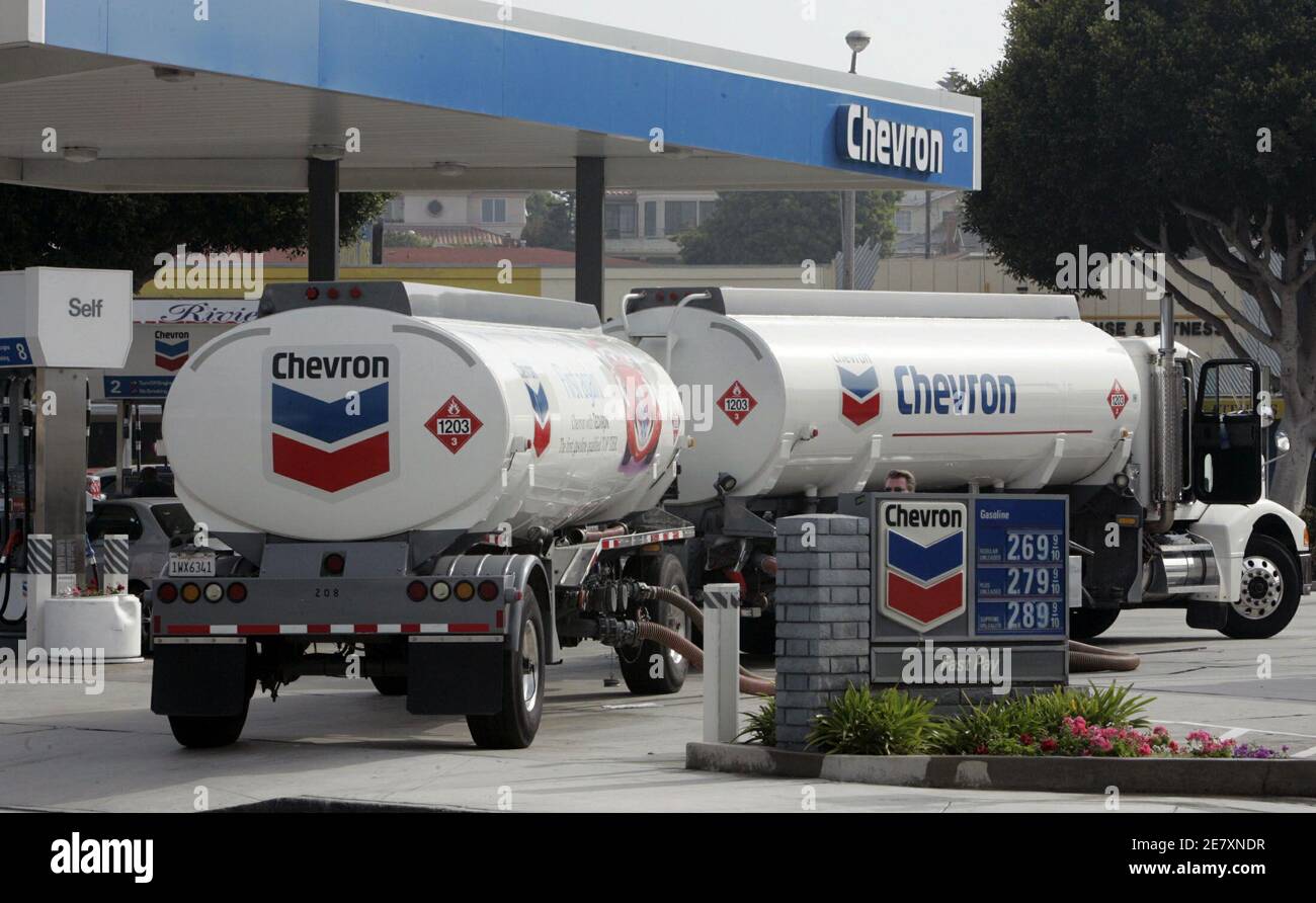 Chevron Corporation gasoline tank trucks deliver gas to a Chevron service station in Redondo Beach, California August 10, 2005. Chevron Crop. on August 10 said shareholders controlling about 241.9 million Unocal Corp. shares, more than 85 percent of its shares outstanding, opted to accept its acquisition offer in the form of $69 cash for each share held, subject to proration. Stock Photo