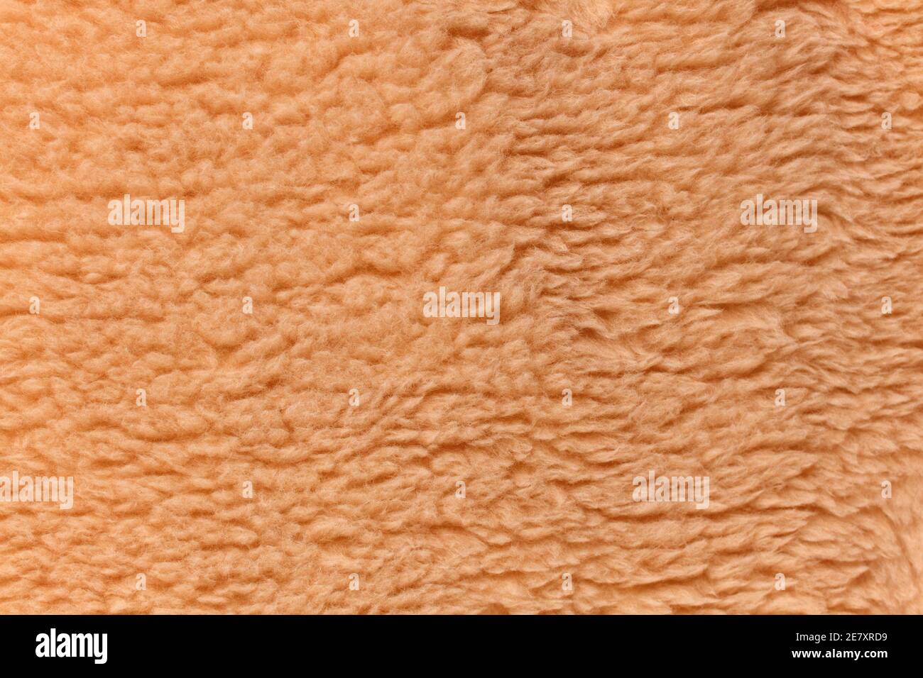 Light brown teddy bear fabric background Stock Photo
