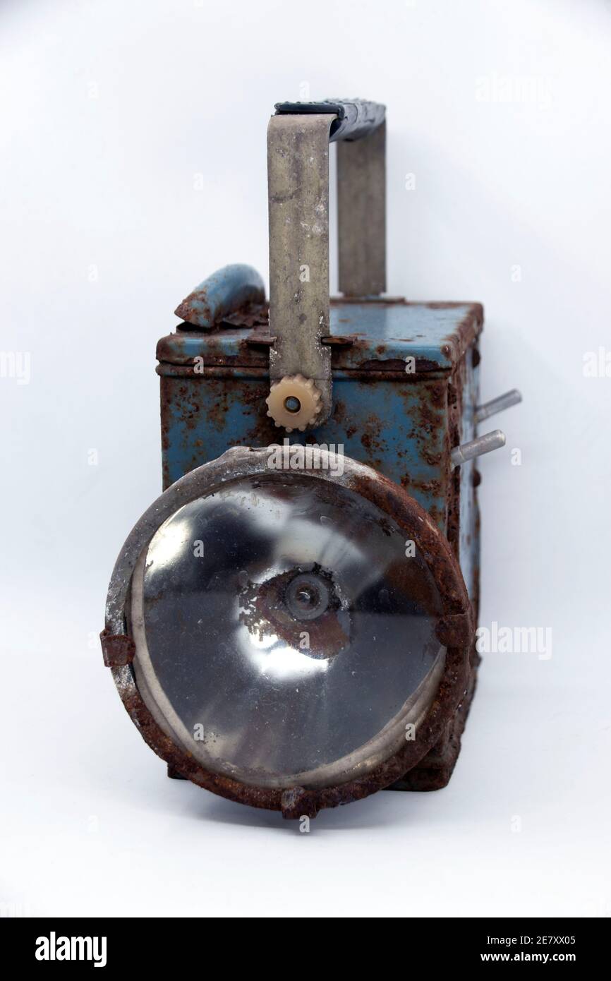 Old rusty blue railway lantern on white background. Stock Photo