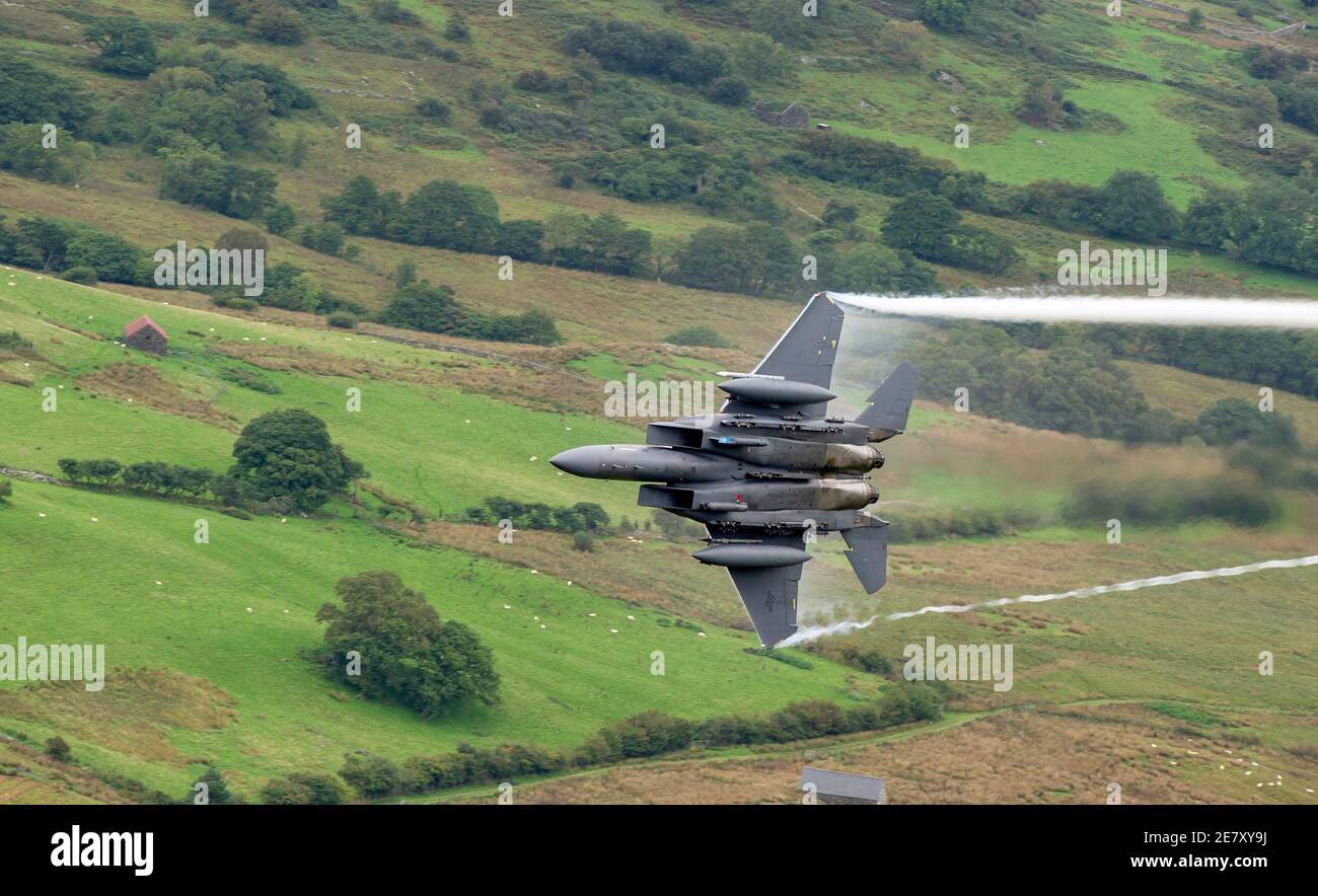 U.S Air force F15 with compressed water vapour coming from wings, Mach loop , Wales Stock Photo