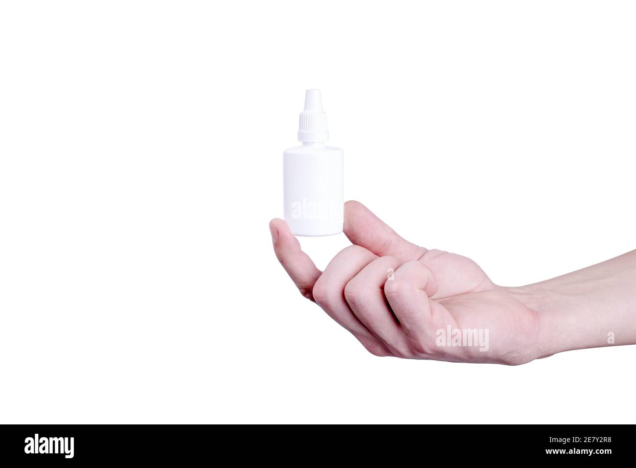 person hold in arm white nasal spray bottle. isolated on white background Stock Photo