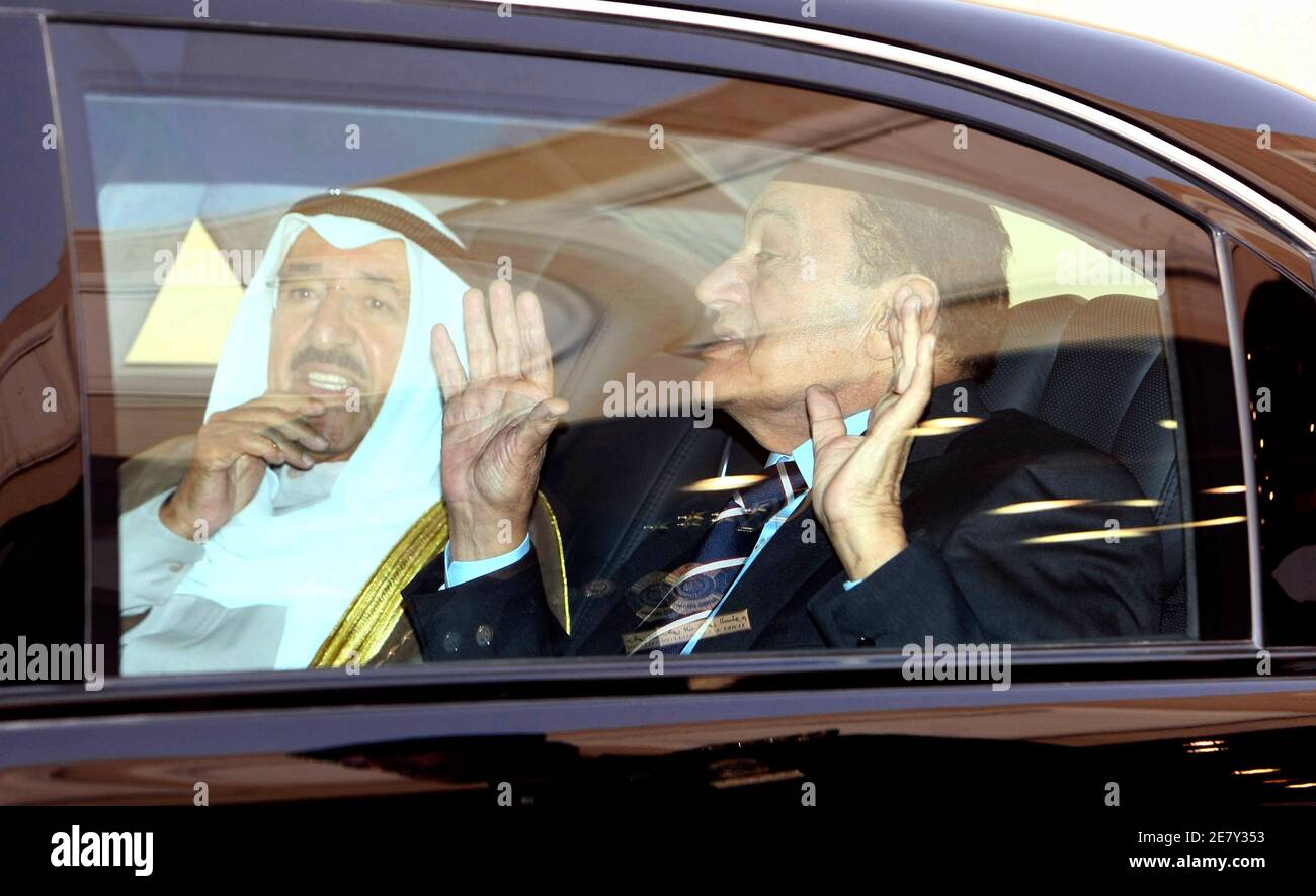 Egypt's President Hosni Mubarak gestures as he chats with Kuwait's Emir  Sheikh Sabah al-Ahmad a-Sabah (L) and Syria's President Bashar al-Assad  (not pictured) in a car at Riyadh airport March 11, 2009.