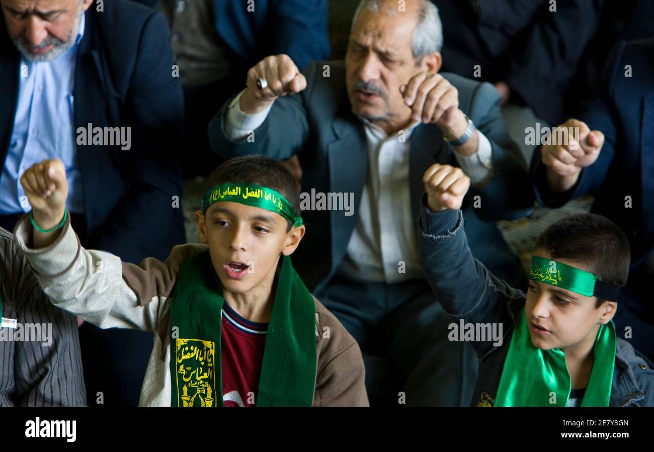 Worshipers shout slogans against the U.S. and Israel during Friday prayers in Tehran  May 1, 2009. REUTERS/Raheb Homavandi (IRAN POLITICS RELIGION) Stock Photo