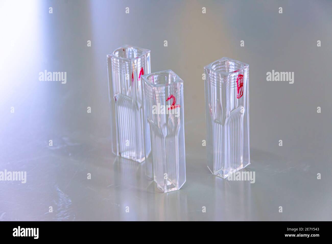 Labeled empty quartz cuvette on the lab table used for