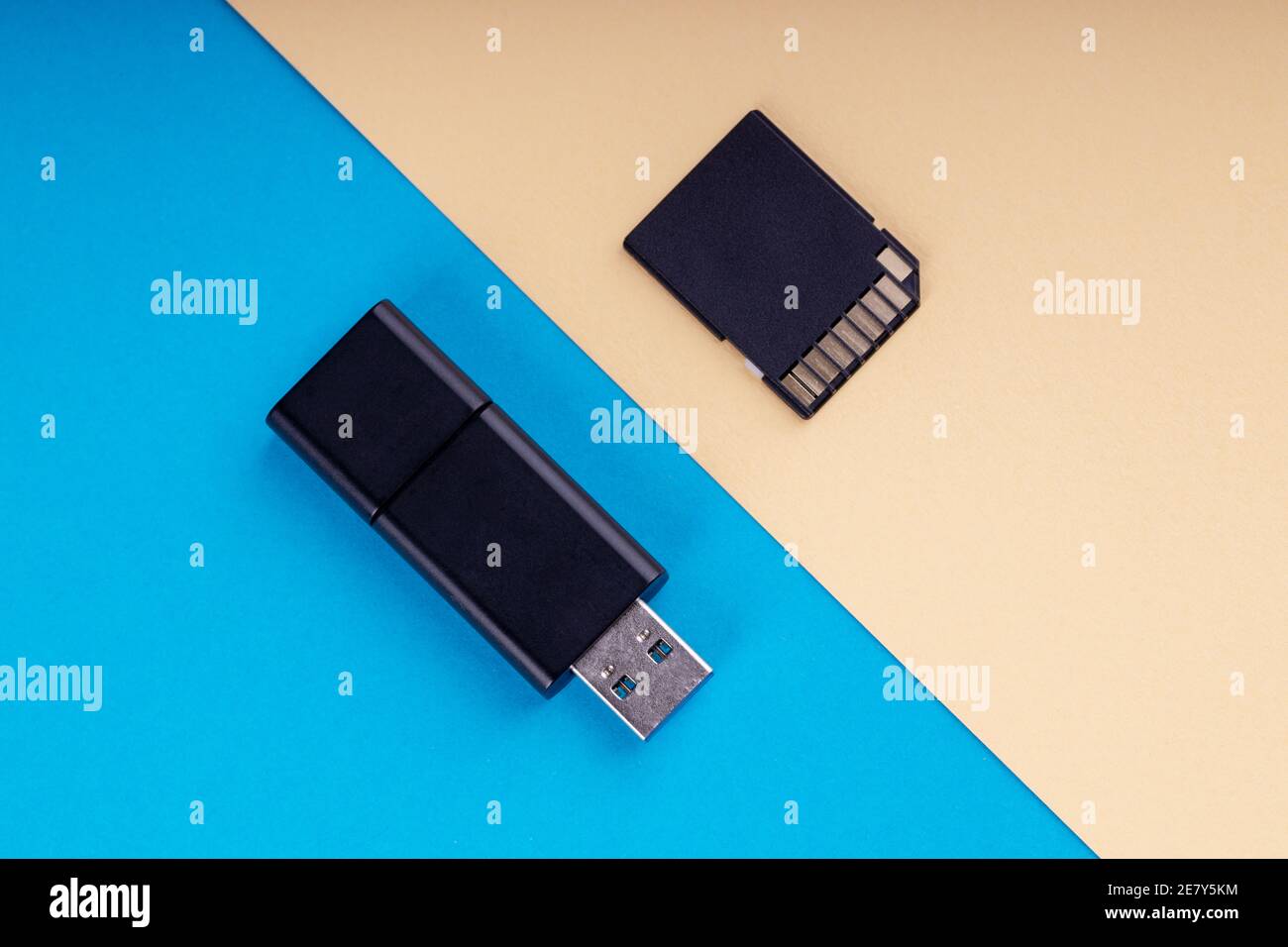 usb flash and sd memory card on blue and yellow background. different kind  of portable storage devices. data store concept Stock Photo - Alamy