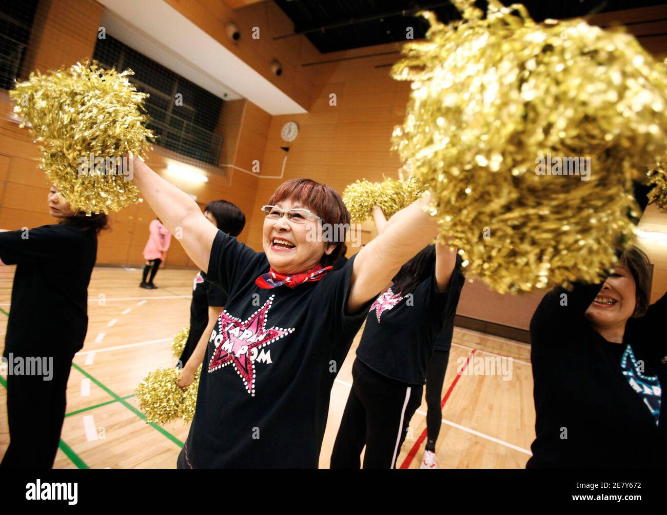 Fumie Takino, a 78-year-old cheerleader, practices cheerleading with other members of a seniors' cheerleading group called "Japan Pom Pom" in Tokyo March 24, 2010. Japan may have to celebrate with its
