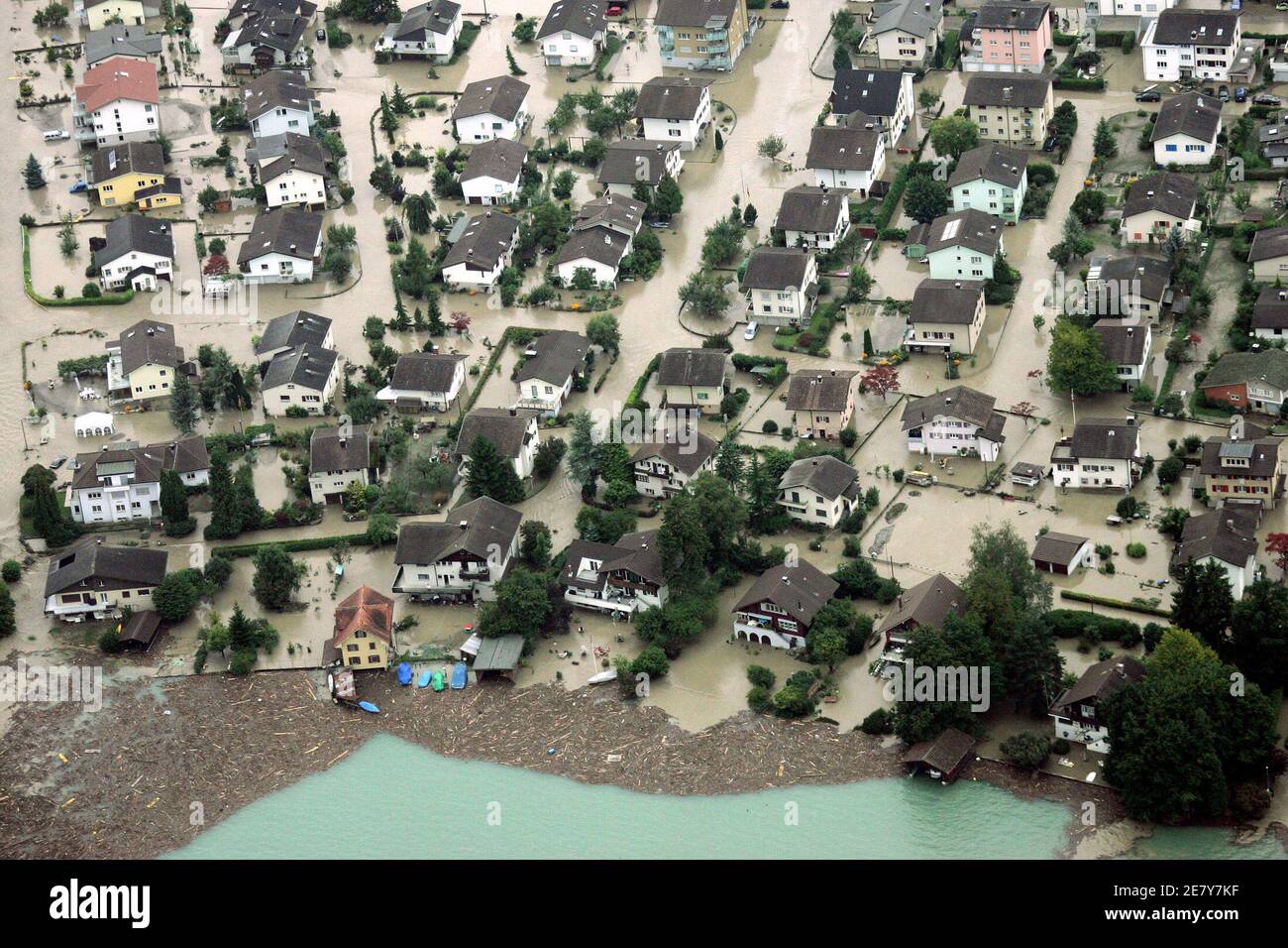 An aerial view shows the flooded village of Buochs, central Switzerland,  August 23, 2005. Three people died and hundreds of people were evacuated  from their homes overnight as Switzerland struggled with flooding