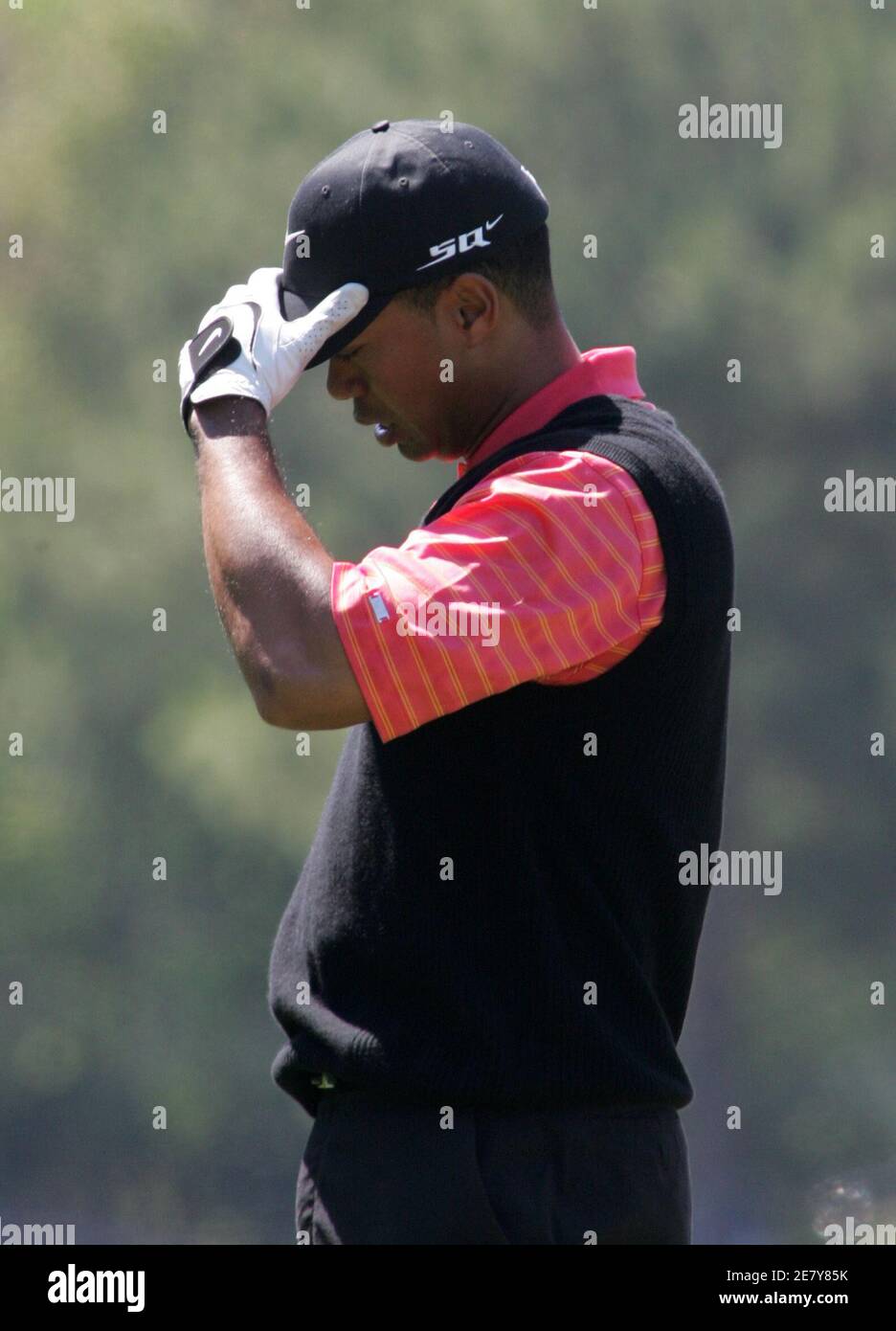 Tiger Woods of the U.S. reacts after hitting into a sand trap on the seventh hole during the final round at the Players Championship golf tournament in Ponte Vedra Beach, Florida March 26, 2006. REUTERS/Rick Fowler Stock Photo