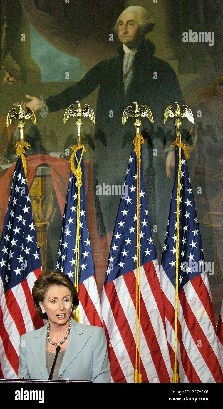 Representative Nancy Pelosi (D-CA), soon to be Speaker of the House in the aftermath of the midterm elections, speaks to the media under a portrait of George Washington, the day after Democrats took control of the House for the first time in 12 years, on Capitol Hill November 8, 2006.        REUTERS/Mike Theiler  (UNITED STATES) Stock Photo