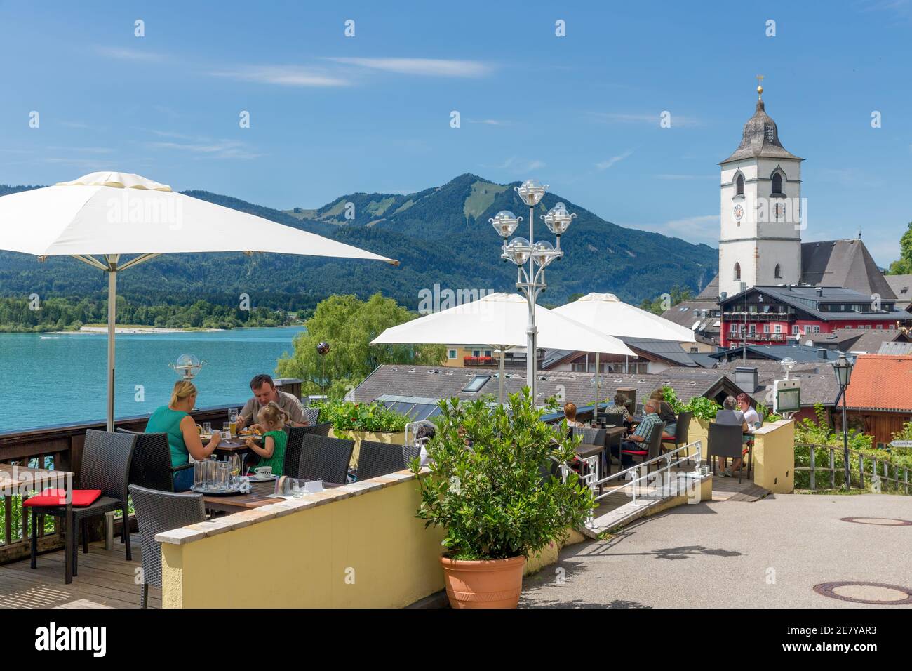 Family eating at terrace restaurant Sankt Wolfgang am Wolfgangsee, Austria Stock Photo