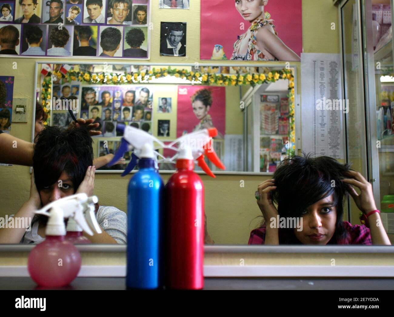 Members of a group known as Pokemon have their hairstyle done at a beauty  parlour in Santiago January 17, 2008. Pokemon, the popular Japanese series  of cartoon characters whose name comes from