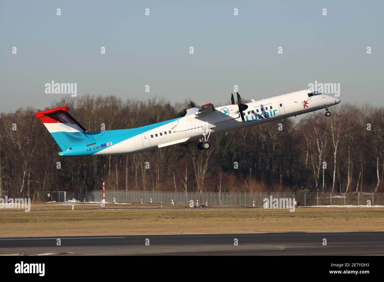 Luxair Bombardier Dash 8 Q400 with registration LX-LGH just airborne at Hamburg Airport. Stock Photo