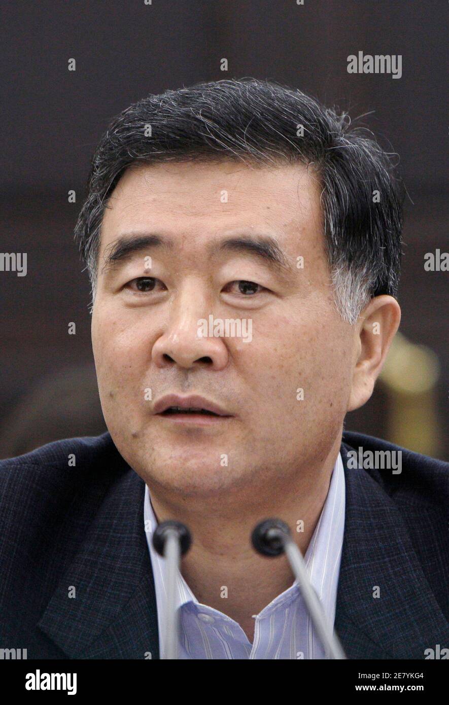 Wang Yang, Guangdong's powerful Communist Party boss who has close ties to President Hu Jintao, speaks during a news conference in the southern Chinese city of Guangzhou July 30, 2009. Wang said it was time for a rethink on ethnic policies, though he did not say specifically what was wrong or offer solutions. A senior Chinese official made a rare admission on Thursday that the country had to change its policies toward ethnic minorities in light of deadly riots in far western Xinjiang this month.    REUTERS/Tyrone Siu    (CHINA POLITICS) Stock Photo