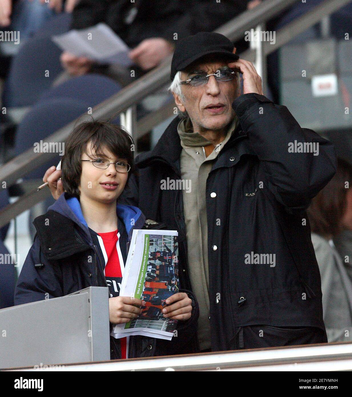 French actor Gerard Darmon and his son attend the French first league football match Paris Saint-Germain vs Le Mans at the Parc des Princes in Paris, France, on April 7, 2007. PSG won 2-1. Photo by Mehdi Taamallah/Cameleon/ABACAPRESS.COM Stock Photo