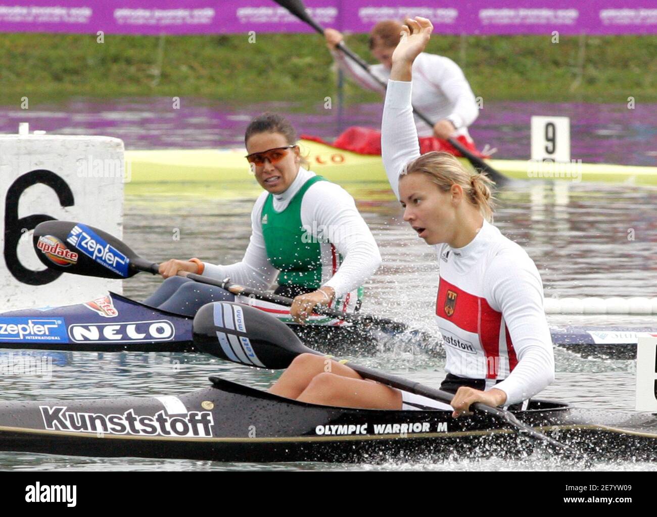 Germany's Nicole Reinhardt (R) celebrates her victory in the women's K1, 500  metres race during the