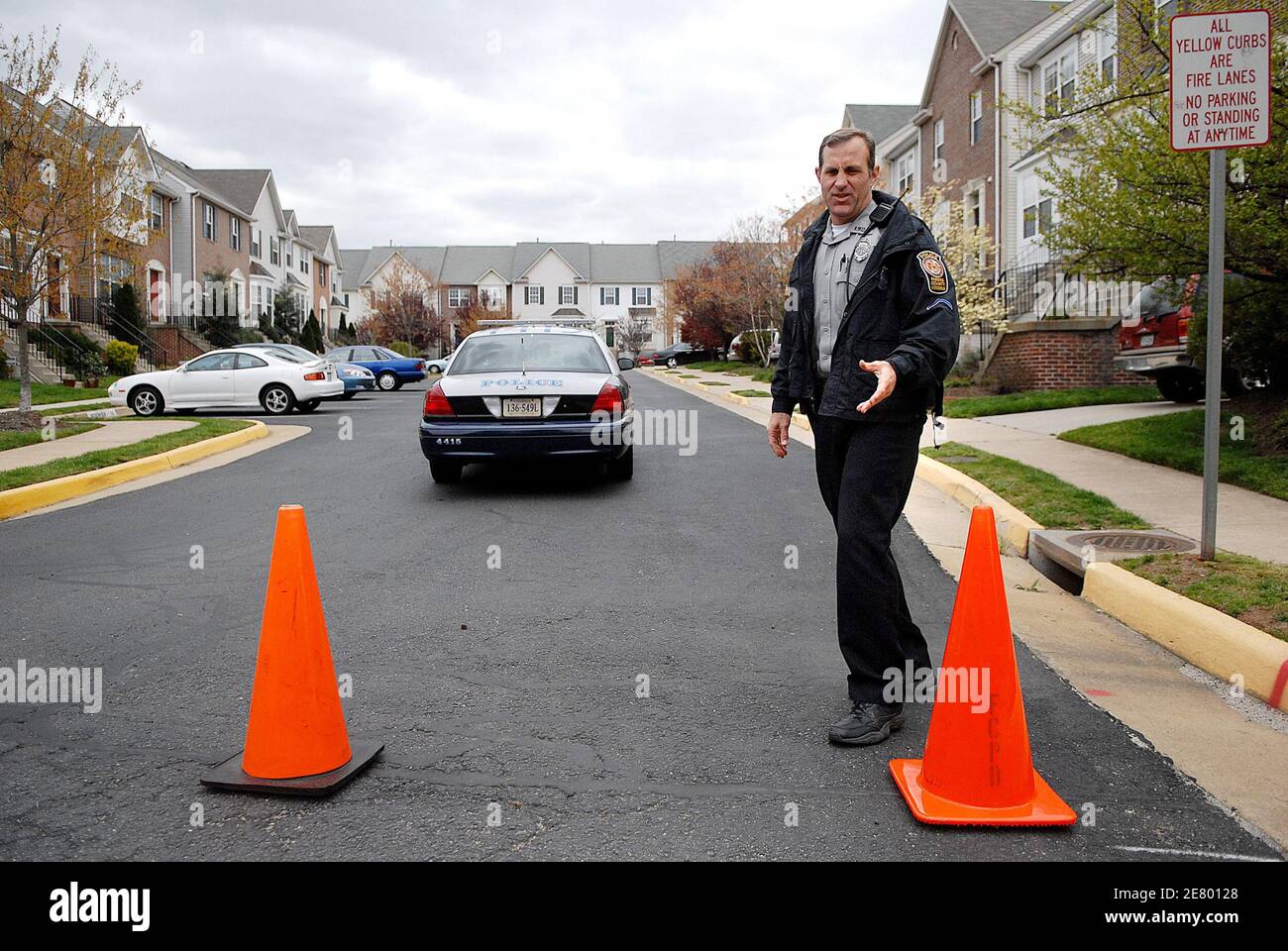 A Fairfax County Policeman patrols with his car in front of the townhouse listed as Cho Seung-Hui's address in Centreville, VA, USA on April 18, 2007. Officials have named Seung-Hui, the 23-year-old South Korean native, as the suspect in the killing rampage at Virginia Tech yesterday killing 32 and self. Photo by Olivier Douliery/ABACAPRESS.COM Stock Photo