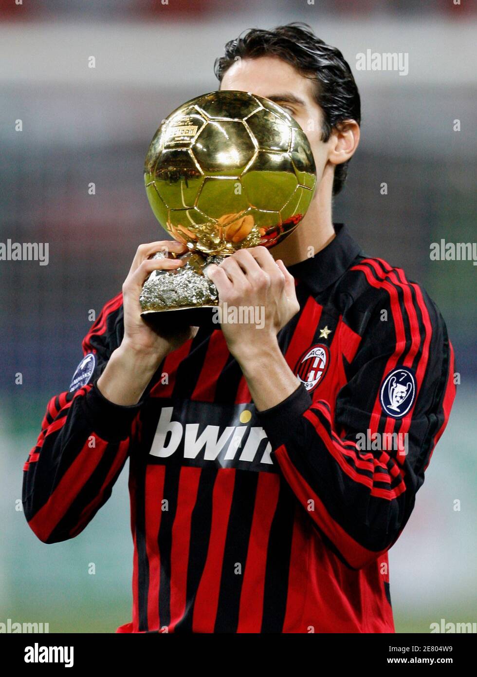 AC Milan and Brazil playmaker Kaka kisses the 2007 Ballon d'Or trophy  before the start of the Champions League Group D soccer match between AC  Milan and Celtic at the San Siro