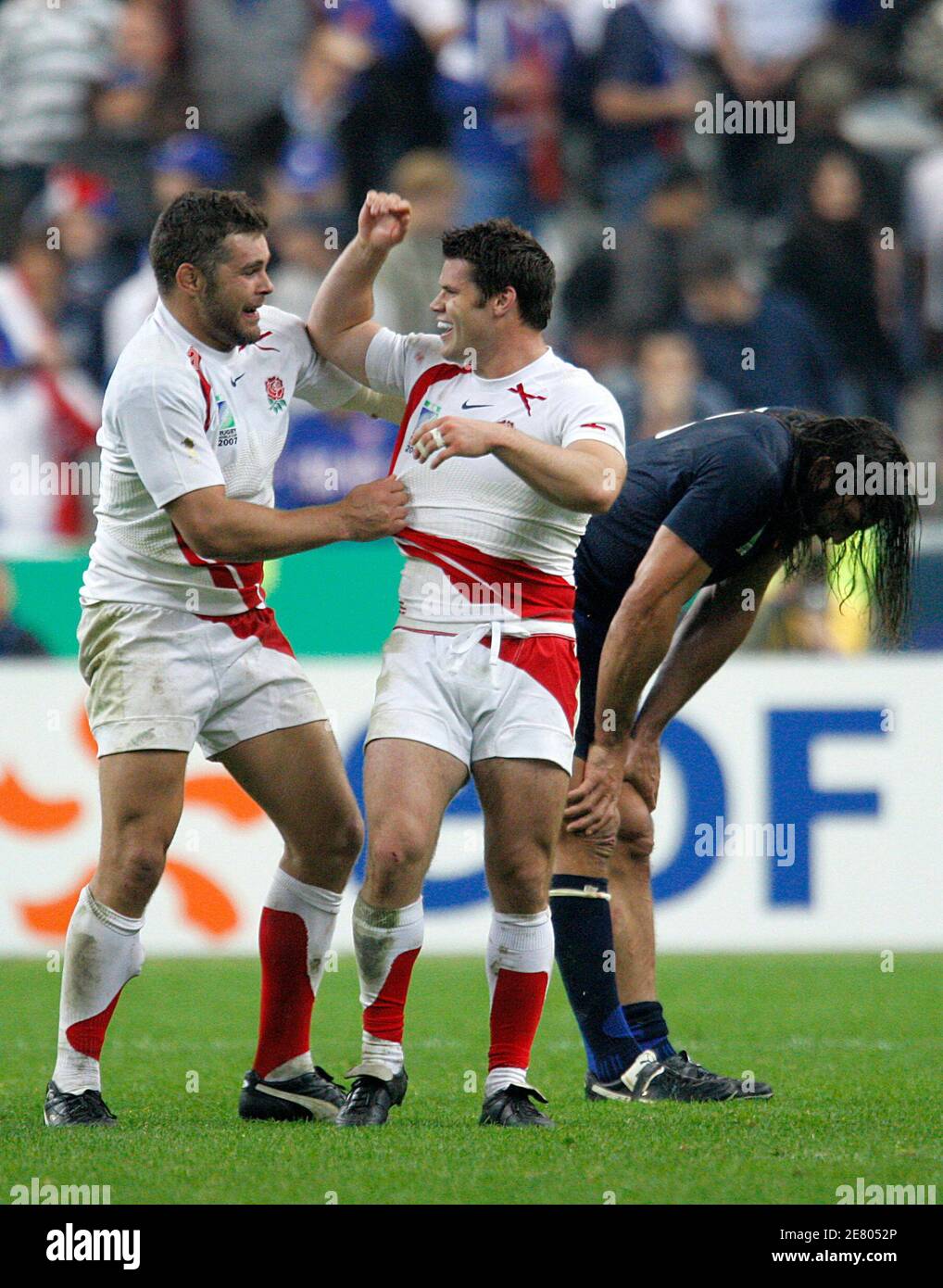 France's Sebastien Chabal (L) reacts near team mate Pieter de Villiers in  the Group D Rugby World Cup match against Ireland at the Stade de France  Stadium in Saint-Denis, near Paris, September