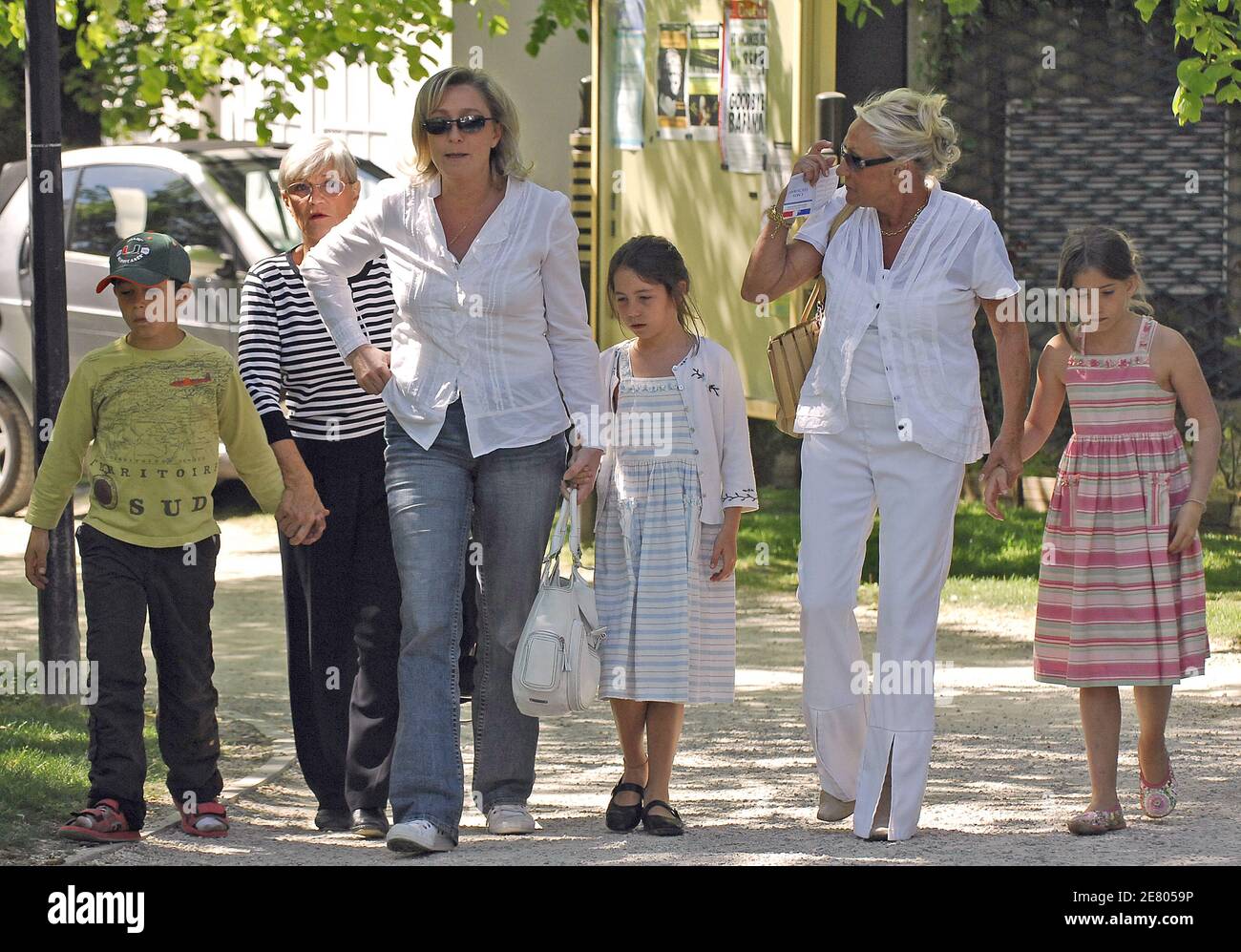 Please hide children faces prior to the publication Far-right Jean-Marie Le  Pen's daughter Marine Le Pen with her children Louis, Mathilde and Jehanne,  leaves the polling station after she casts her ballot