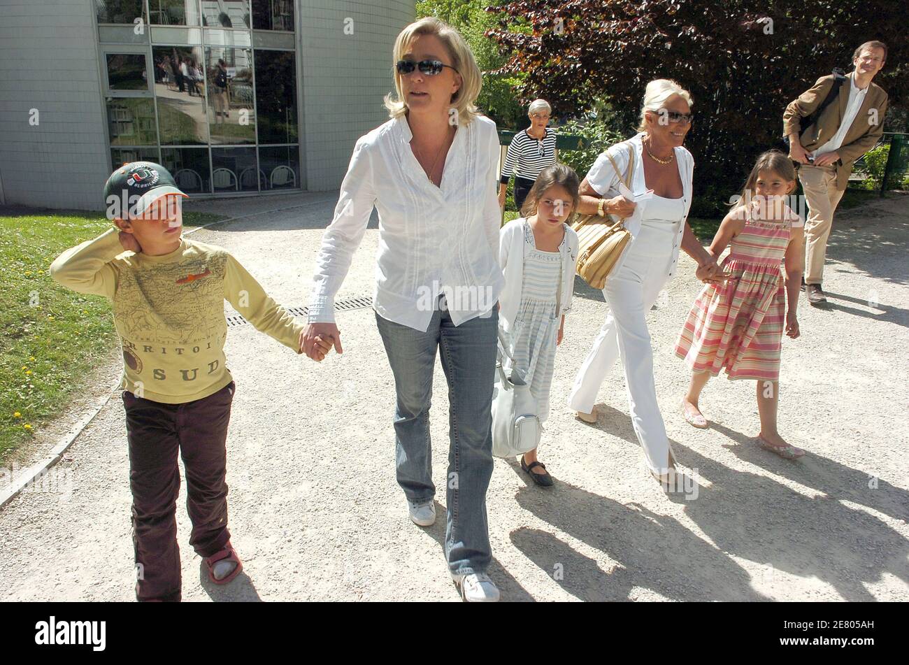 Please hide children faces prior to the publication Far-right Jean-Marie Le  Pen's daughter Marine Le Pen with her children Louis, Mathilde and Jehanne,  leaves the polling station after she casts her ballot