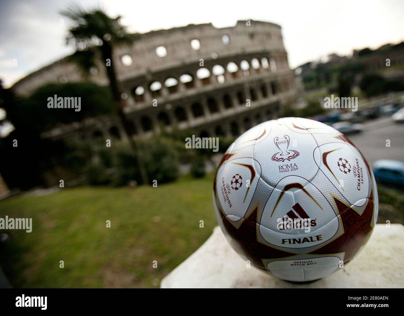 The official match ball of the UEFA Champions League final, to take place  in Rome on May 27, is displayed during its unveiling ceremony in front of  Rome's ancient Colosseum March 16,