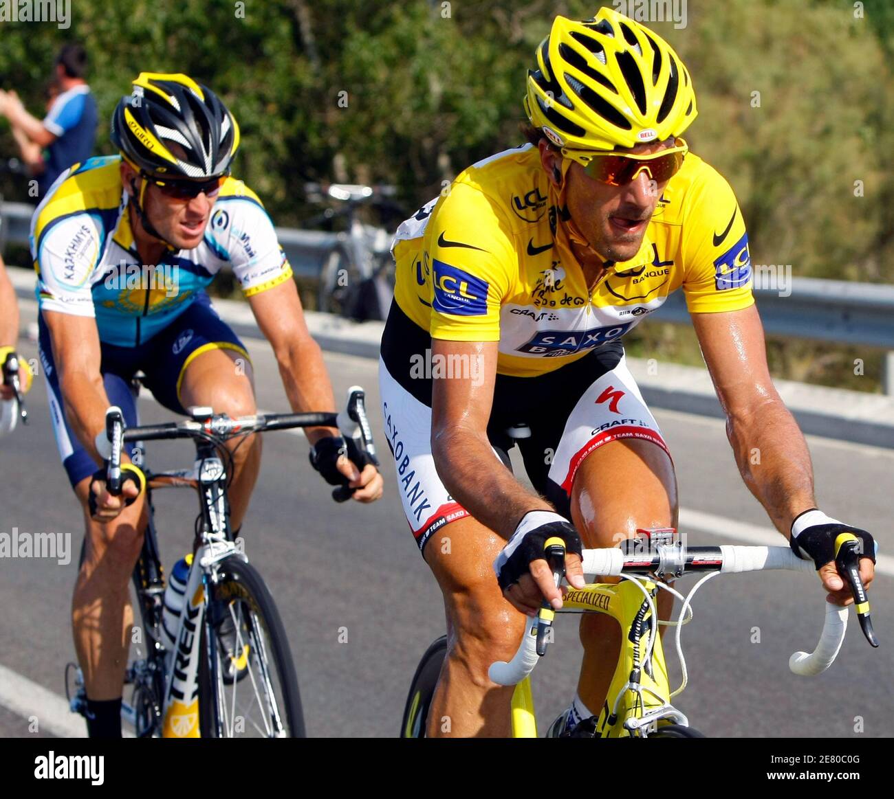 Team Saxo Bank rider and leader's yellow jersey Fabian Cancellara of  Switzerland (R) cycles with Astana rider Lance Armstrong of the U.S. (L)  during the third stage of the 96th Tour de