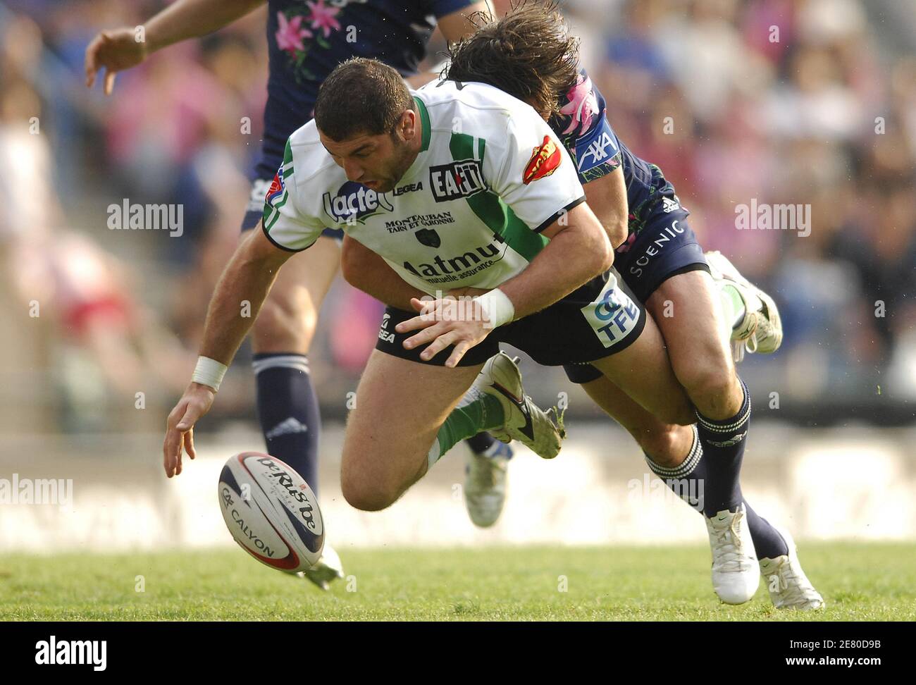 Montauban's Marc Raynaud takled by Stade Francais' Christophe Dominici during the French Top 14 rugby union match, Stade Francais vs Montauban, at the Jean Bouin stadium, in Paris, France, on April 28, 2007. Stade Francais won 24-17. Photo by Nicolas Gouhier/Cameleon/ABACAPRESS.COM Stock Photo