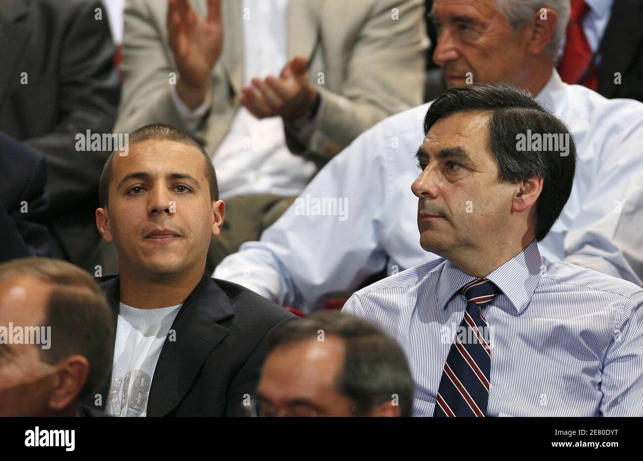 'Singer Faudel and Francois Fillon are seen listening to Presidential frontrunner Nicolas Sarkozy adressing tens of thousands of supporters at Paris Bercy concert hall in Paris, France, April 29, 2007. Sarkozy went on the offensive Sunday, charging that he had been unjustly depicted as authoritarian as the battle for the Elysee entered its final week. The rightwinger said he had suffered ''personal attacks'' during the campaign that had targeted his ''honour, sincerity, personality and character.'' Photo By Bisson-Taamallah-Orban/ABACAPRESS.COM' Stock Photo