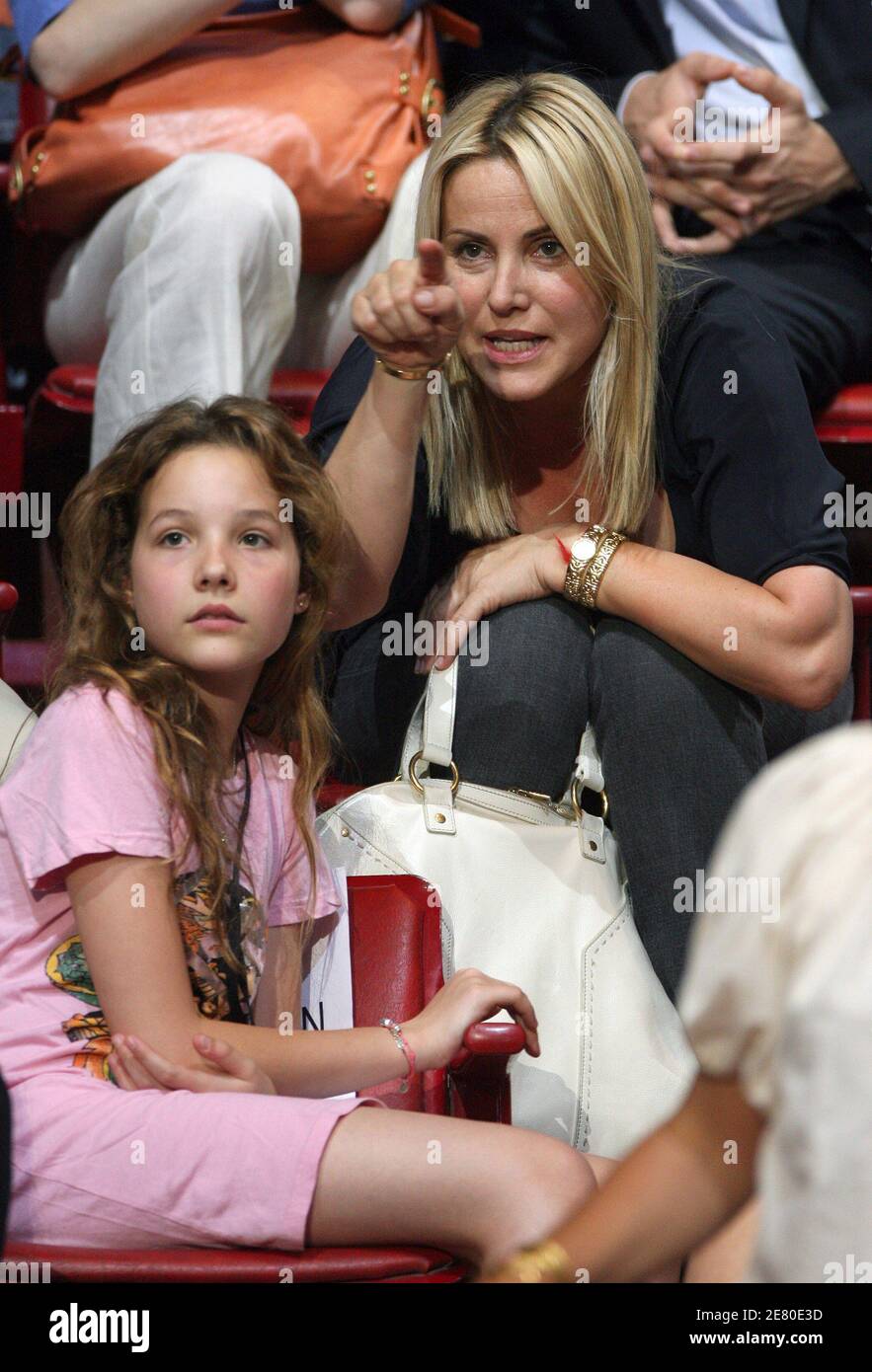 'Sophie Favier with her daughter are seen listening to Presidential frontrunner Nicolas Sarkozy adressing tens of thousands of supporters at Paris Bercy concert hall in Paris, France, April 29, 2007. Sarkozy went on the offensive Sunday, charging that he had been unjustly depicted as authoritarian as the battle for the Elysee entered its final week. The rightwinger said he had suffered ''personal attacks'' during the campaign that had targeted his ''honour, sincerity, personality and character.'' Photo By Bisson-Taamallah-Orban/ABACAPRESS.COM' Stock Photo
